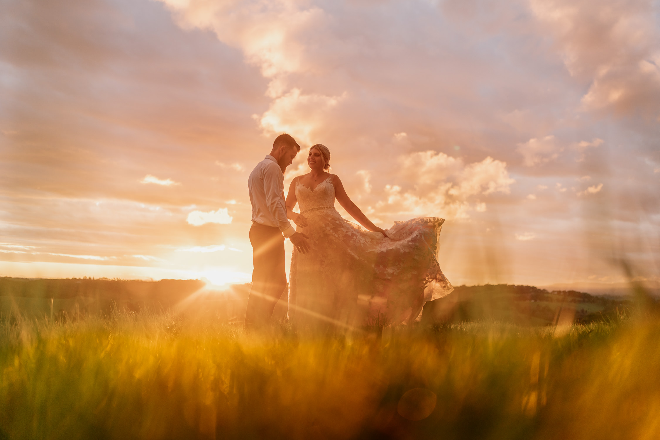 Byron View Farm Wedding bride and groom at sunset with amazing coloured sky